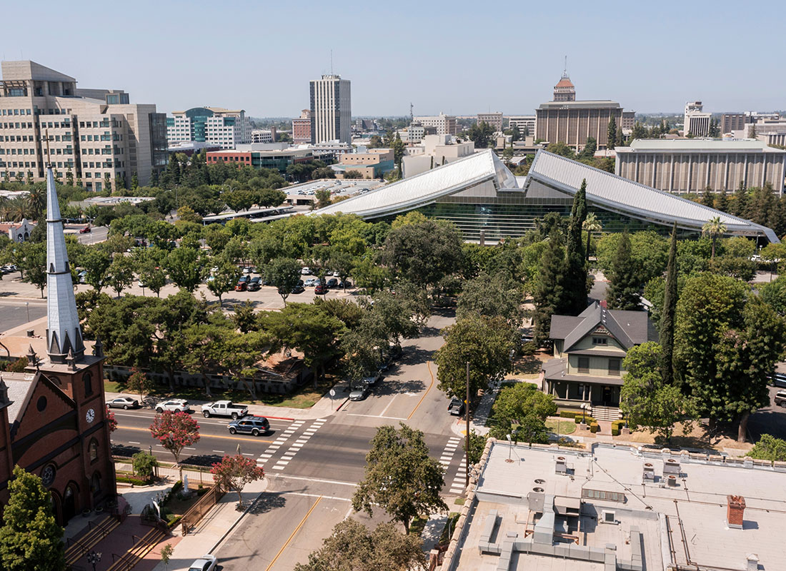 Contact - Aerial View of a Church and Other Commercial Buildings in the Historic District of Downtown Fresno California on a Sunny Day